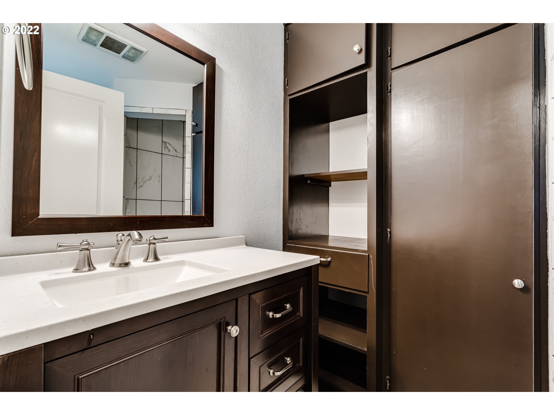 423 F Street Springfield, OR 97477 - Photo 20 of 29 a bathroom with a sink and a mirror