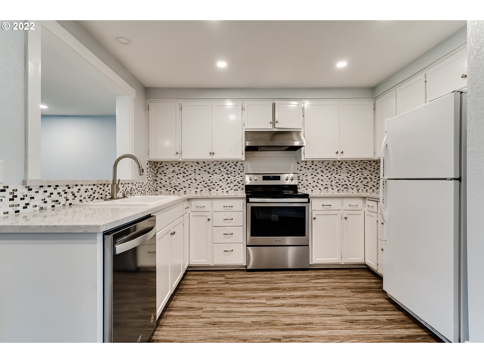 423 F Street Springfield, OR 97477 - Photo 5 of 29 a kitchen with granite countertop a sink stove and refrigerator
