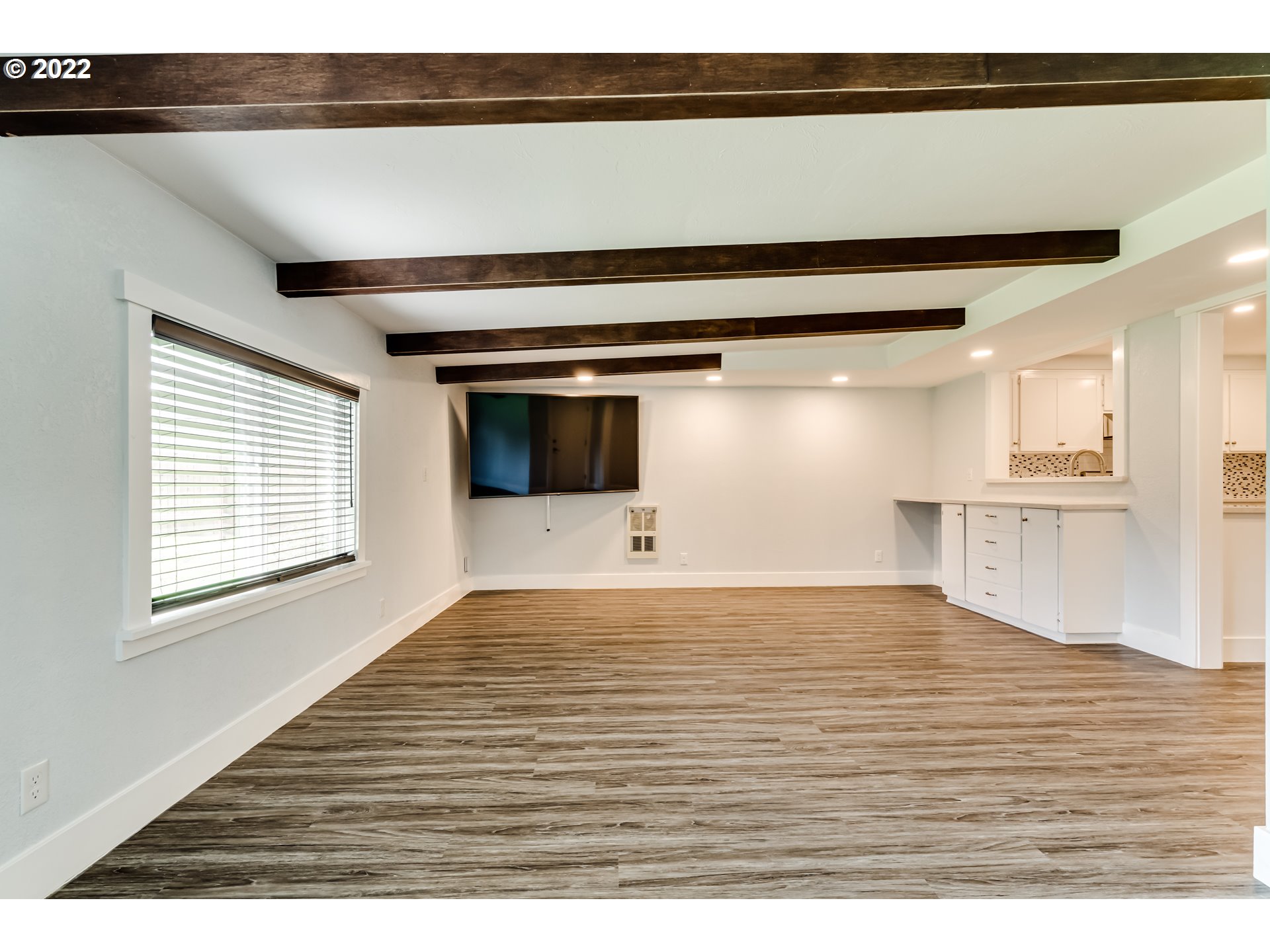 423 F Street Springfield, OR 97477 - Photo 9 of 29 a view of kitchen and empty room with wooden floor