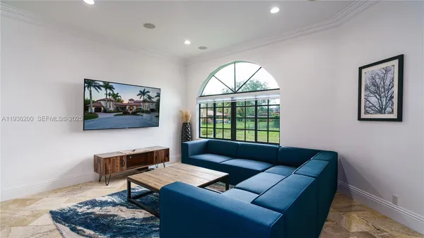 a blue couch sitting next to a blue wall