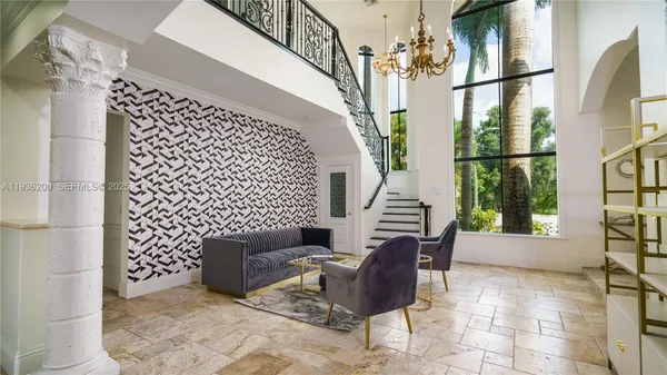 a living room with a large window and table