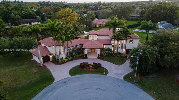an aerial view of house with yard