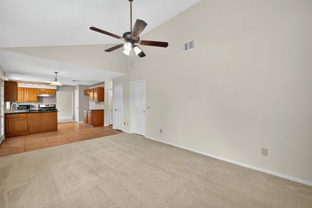 a view of a kitchen with a sink and dishwasher