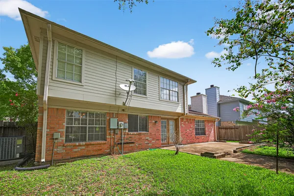 a view of a house with a yard porch and sitting area