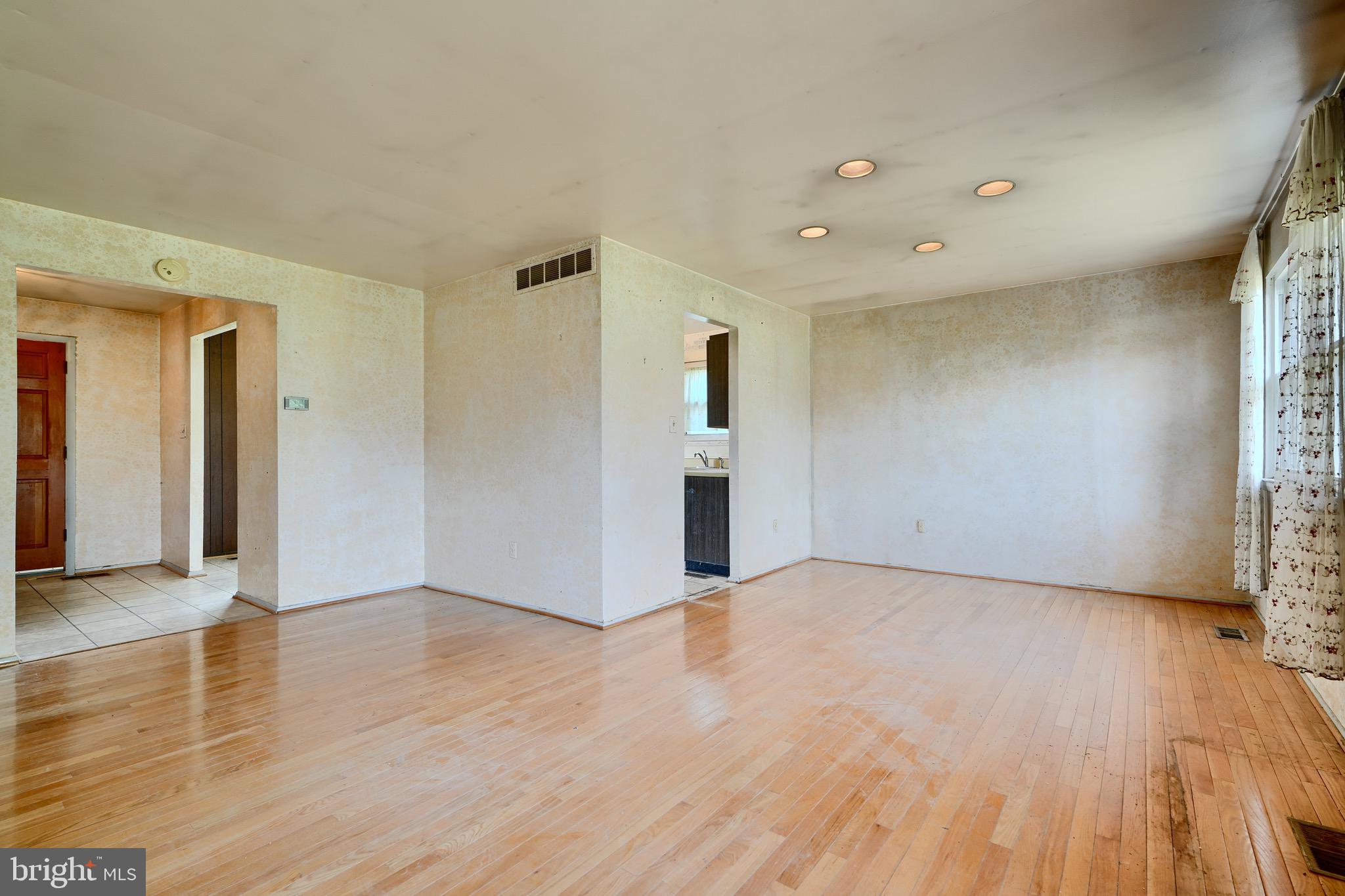 3902 Winlee Road Randallstown, MD 21133 - Photo 14 of 44 a view of an empty room with wooden floor