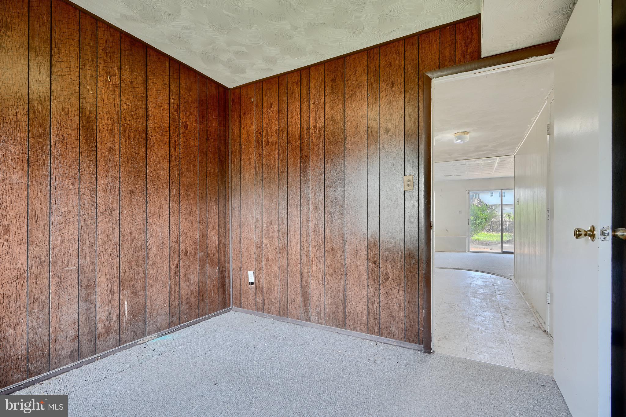 3902 Winlee Road Randallstown, MD 21133 - Photo 35 of 44 an empty room with wooden floor and windows