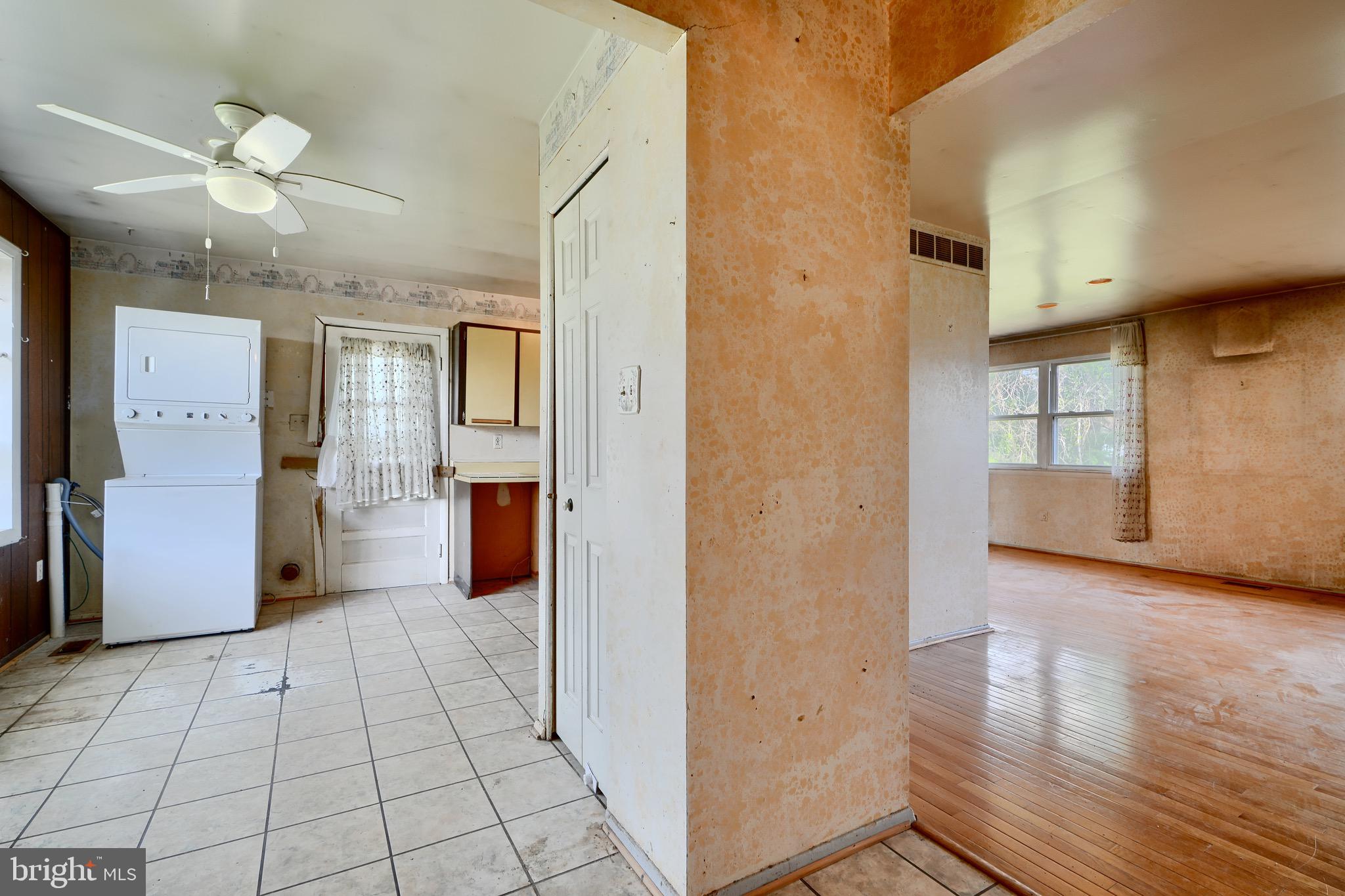 3902 Winlee Road Randallstown, MD 21133 - Photo 7 of 44 an empty room with wooden floor and windows
