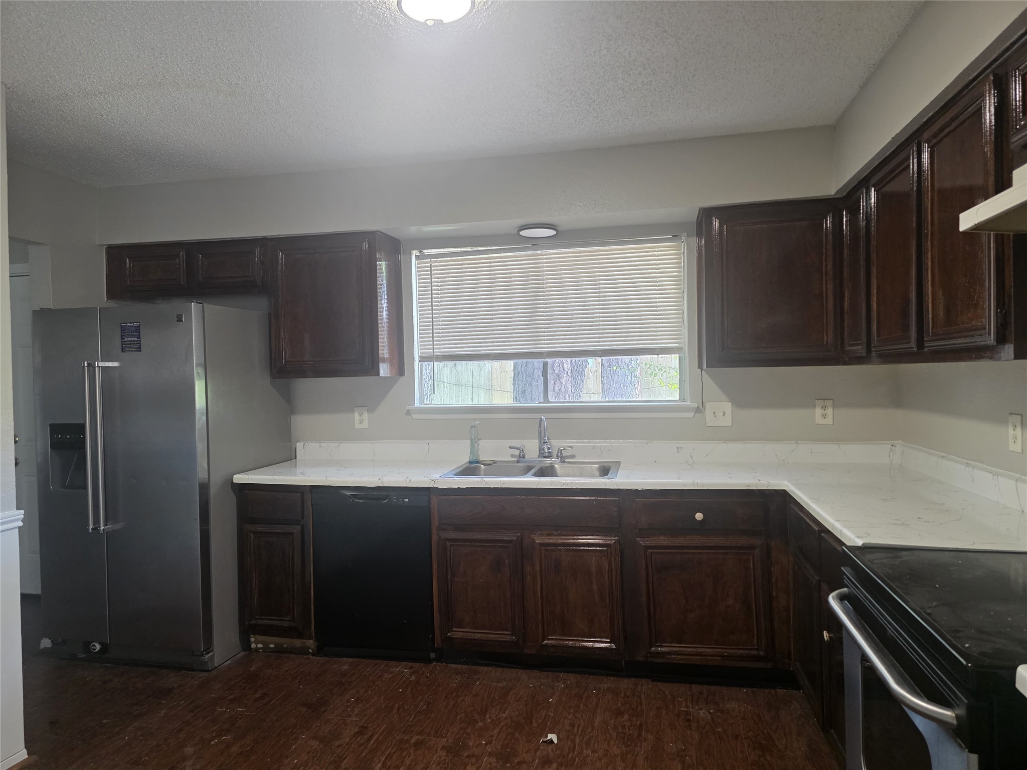 23322 Dew Wood Lane Spring, TX 77373 - Photo 7 of 20 a kitchen with a sink and cabinets