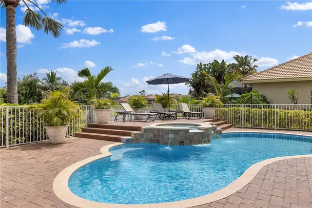 a view of a swimming pool with a patio