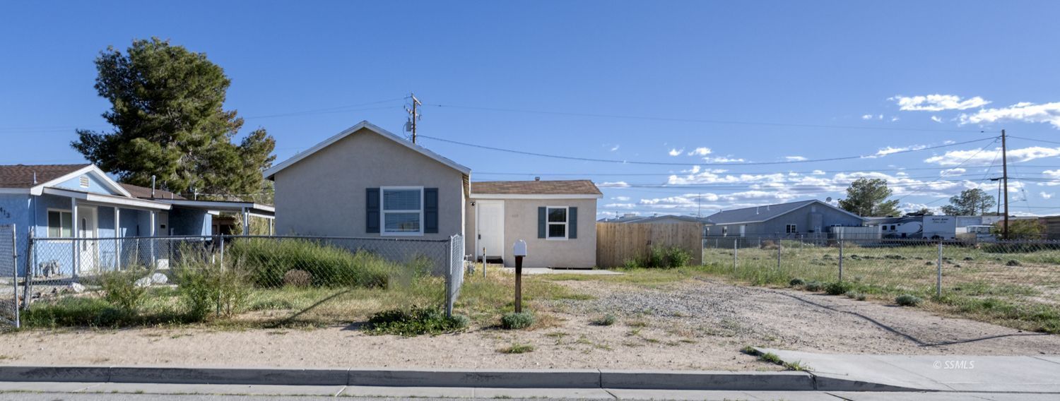 419 West Haloid Avenue Ridgecrest, CA 93555 - Photo 1 of 29 a front view of a house with garden