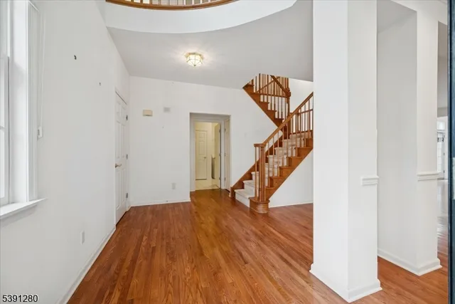 a view of entryway with wooden floor