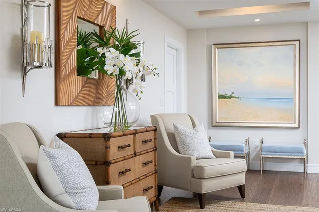 a living room with furniture and a potted plant
