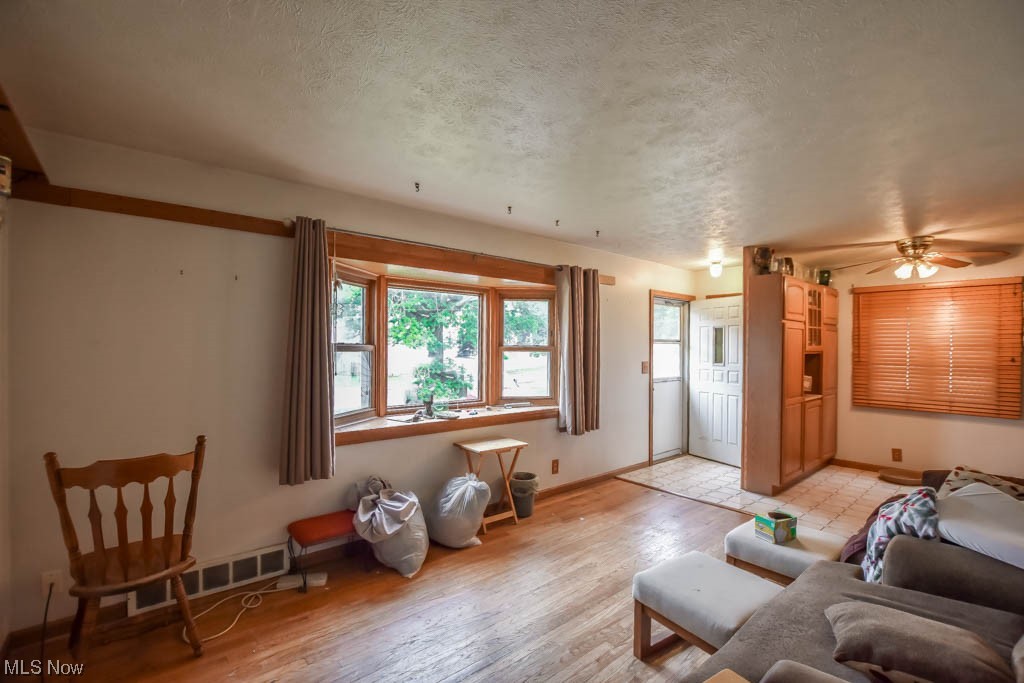 29947 Regent Road Wickliffe, OH 44092 - Photo 3 of 16 Hardwood floored living room with a textured ceiling