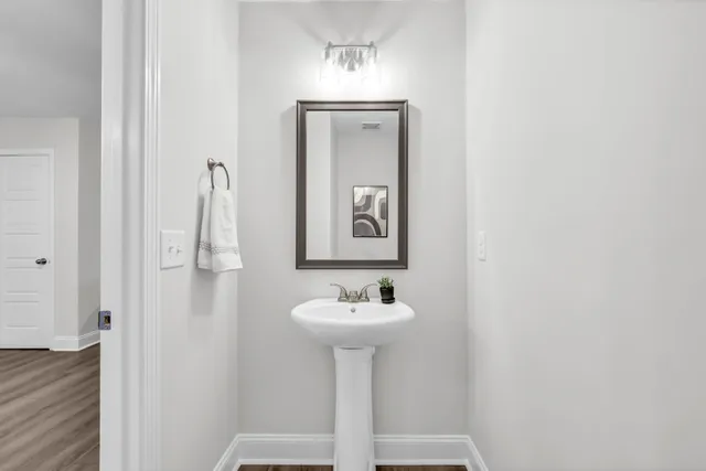 a bathroom with a sink and a mirror