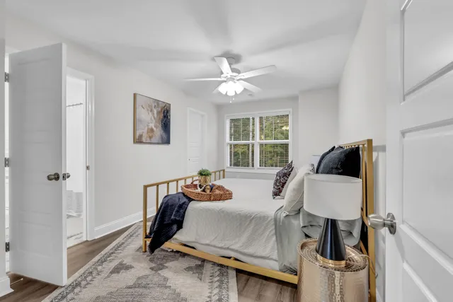a bedroom with furniture and a window