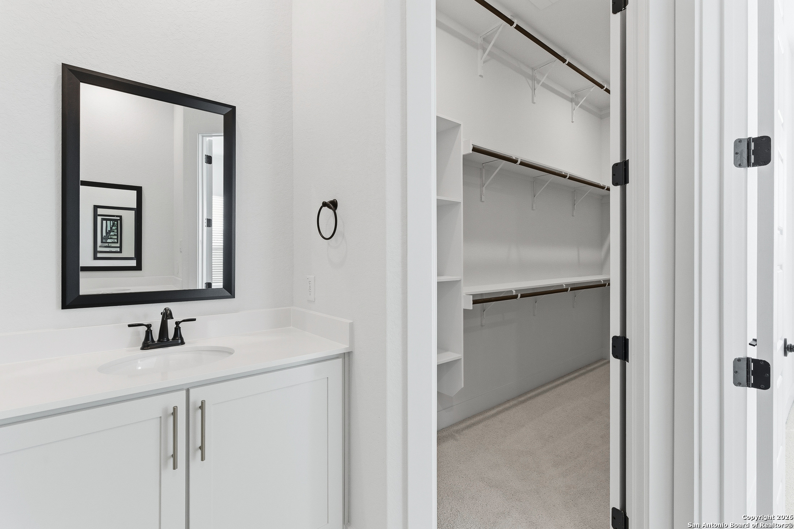 20675 Huebner Road, Unit 527 San Antonio, TX 78258 - Photo 25 of 43 a bathroom with a sink and a mirror