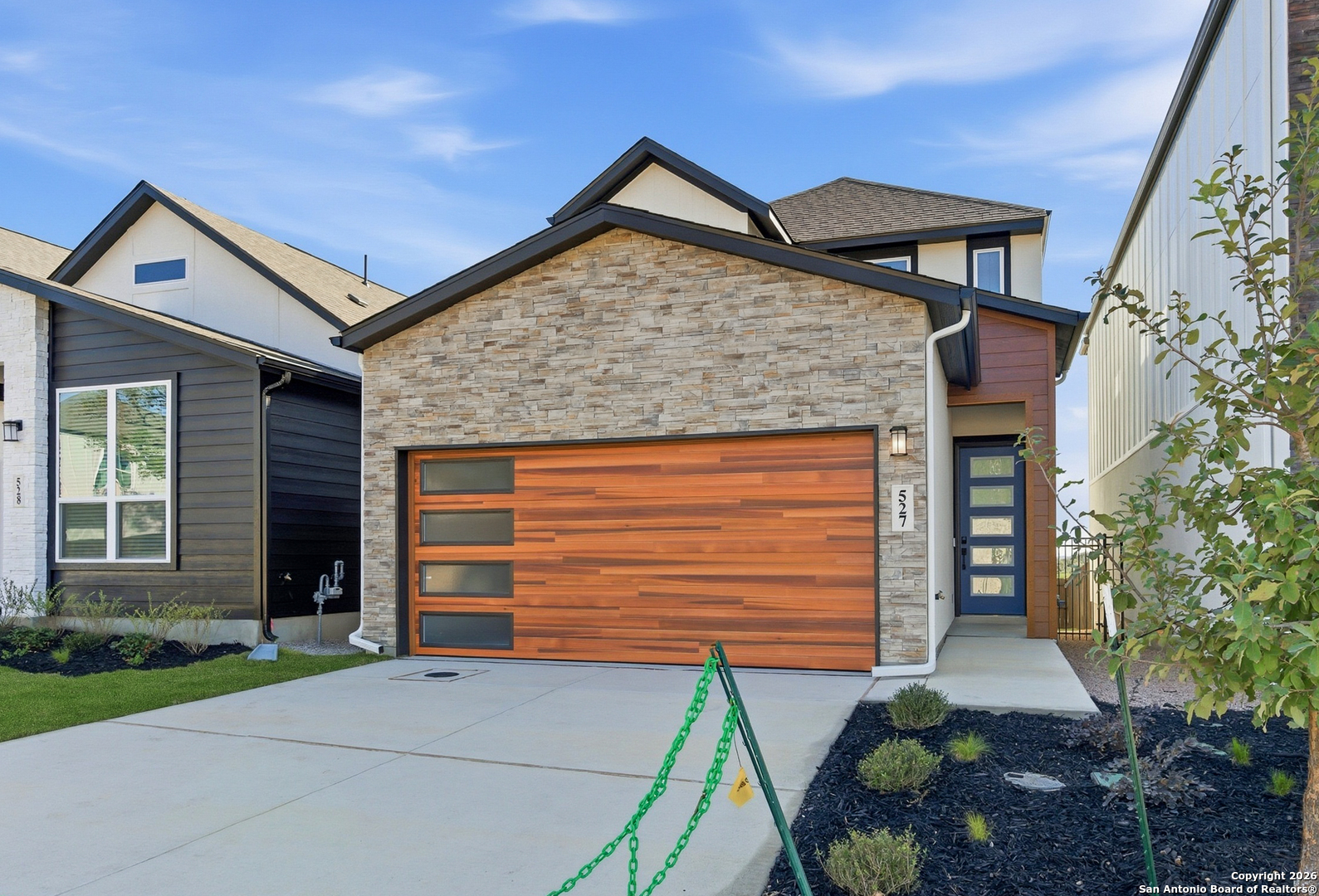 20675 Huebner Road, Unit 527 San Antonio, TX 78258 - Photo 3 of 43 a front view of a house with garden