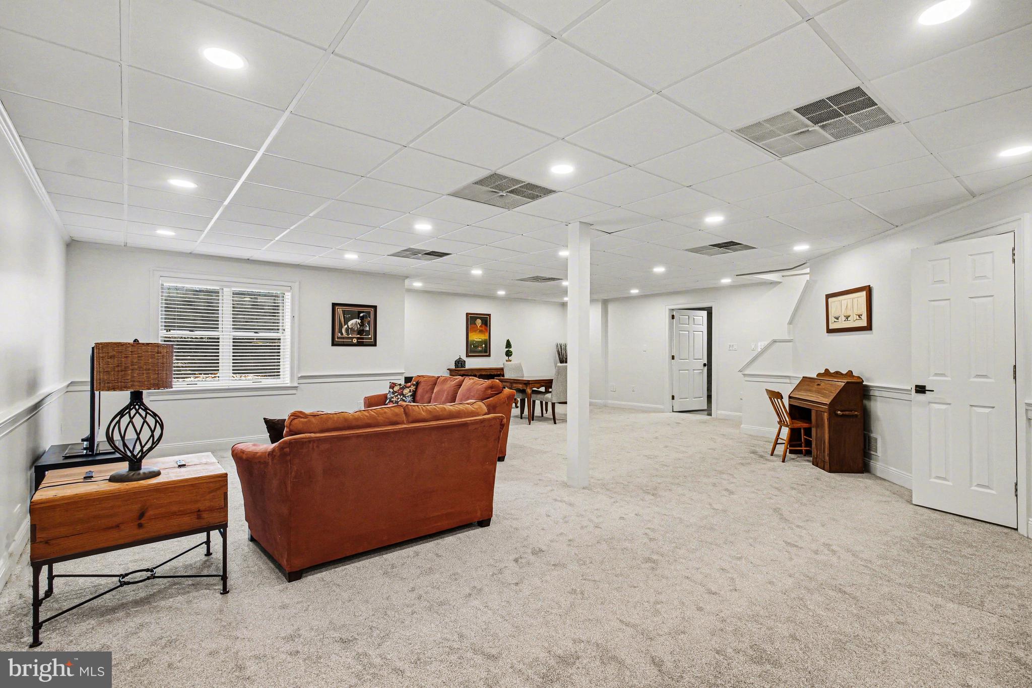 671 Bent Creek Drive Lititz, PA 17543 - Photo 36 of 61 a living room with furniture and a window