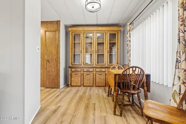 a view of a dining room with furniture and wooden floor