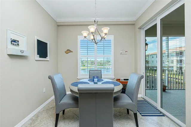 a dining room with furniture window and outside view