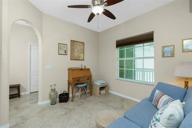 a living room with furniture and a window