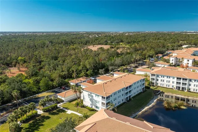 an aerial view of a house with a ocean view
