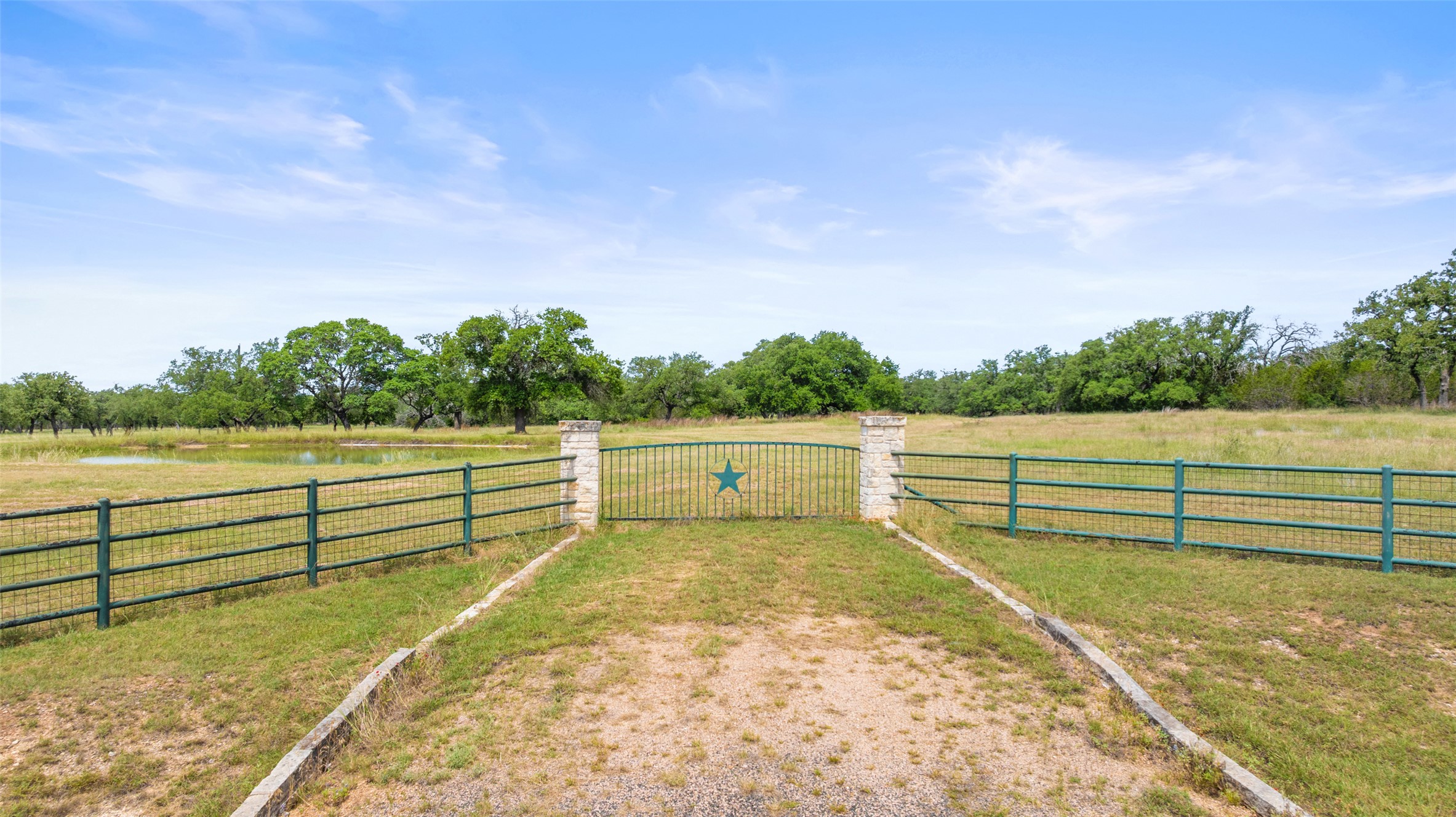 1241-1 Sandy Oaks Ranch Road Johnson City, TX 78636 - Photo 5 of 8 View of yard with a water view, a gate, and a view of rural / pastoral area