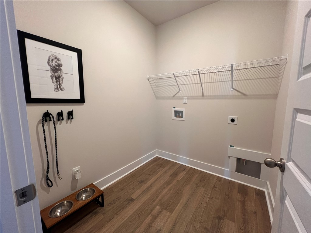 130 Tiger Lily Drive Anderson, SC 29621 - Photo 19 of 27 This large laundry room has laminate hardwood flooring and extra space for storage or pet accessories.