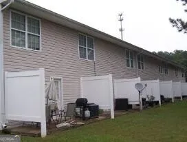 a view of outdoor space with playground and green space