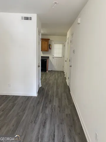 a kitchen with a refrigerator stove and microwave