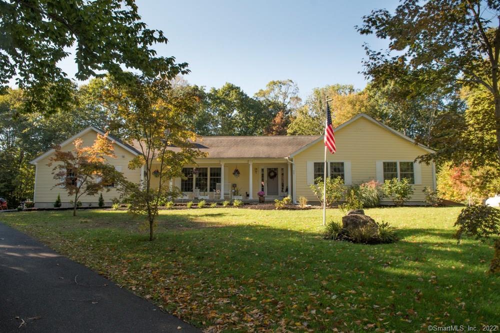 51 Harvey Road Durham, CT 06422 - Photo 1 of 1 a front view of house with a garden and trees