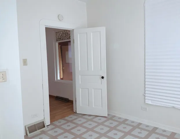 a white toilet sitting next to a bath tub