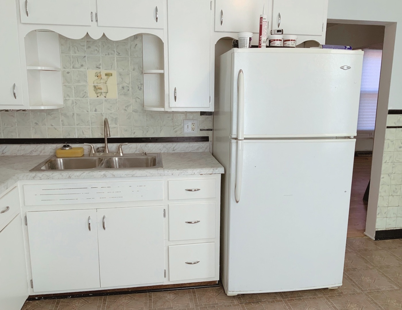 661 Abe Street Joliet, IL 60432 - Photo 5 of 16 a white refrigerator freezer sitting inside of a kitchen
