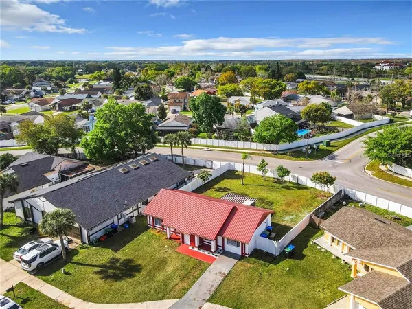 an aerial view of a house with a swimming pool