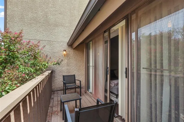 a balcony view with a outdoor seating space