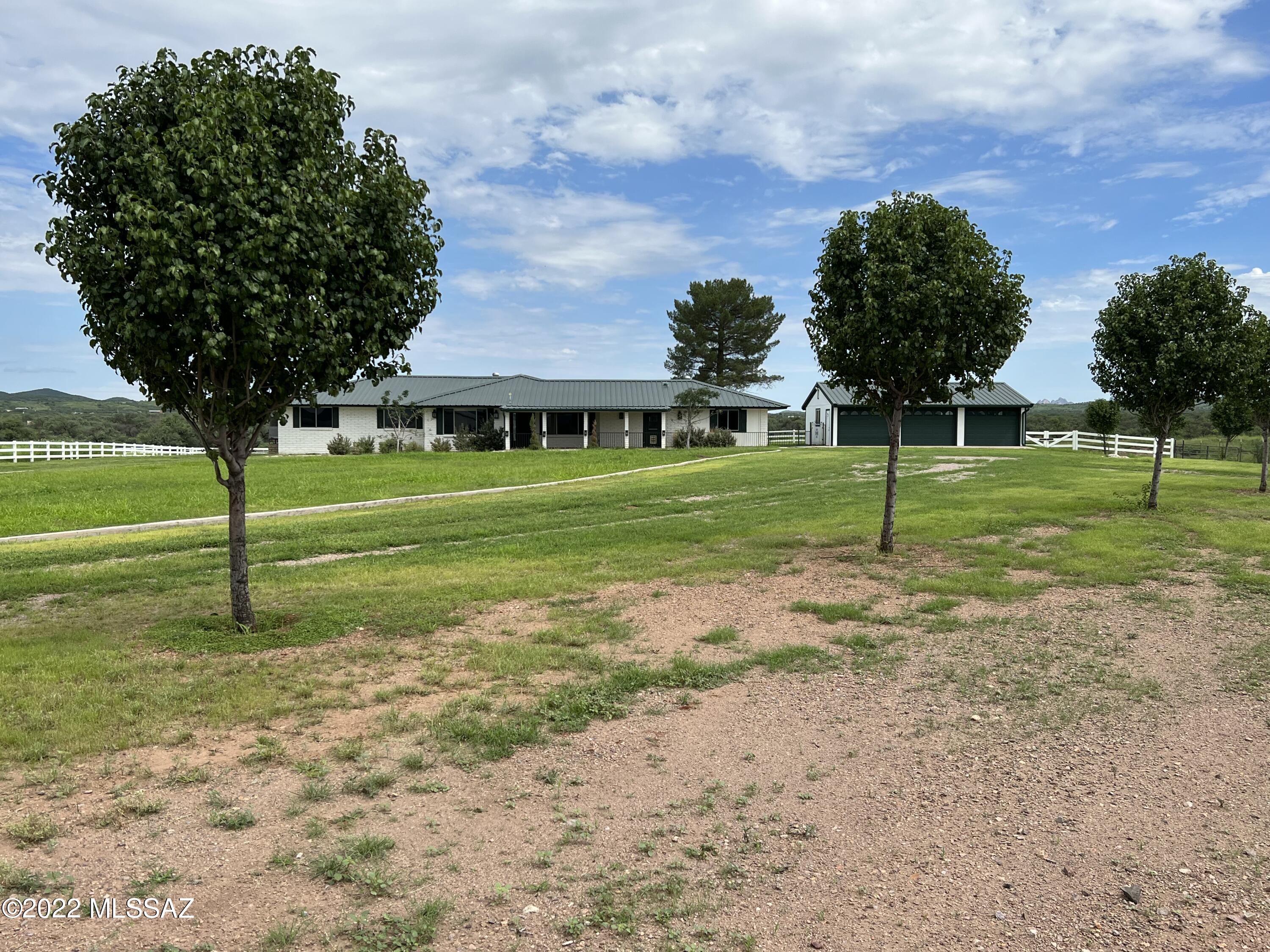 36645 South Arivaca Ranch Road Arivaca, AZ 85601 - Photo 2 of 49 a view of a house with a backyard