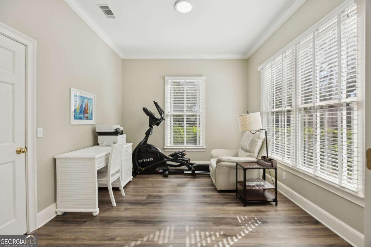 343 Major Wright Road St. Simons, GA 31522 - Photo 17 of 53 a living room with furniture and a large window