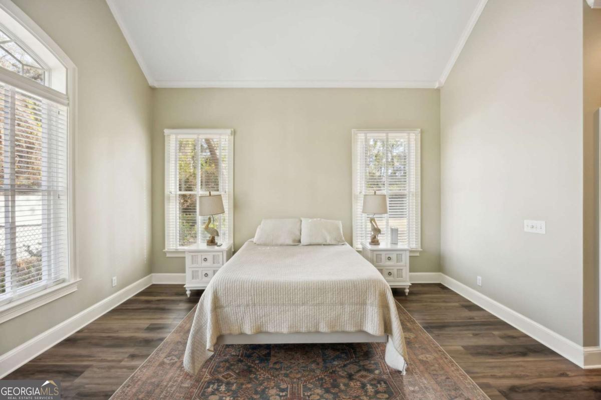 343 Major Wright Road St. Simons, GA 31522 - Photo 19 of 53 a bedroom with a bed and a window