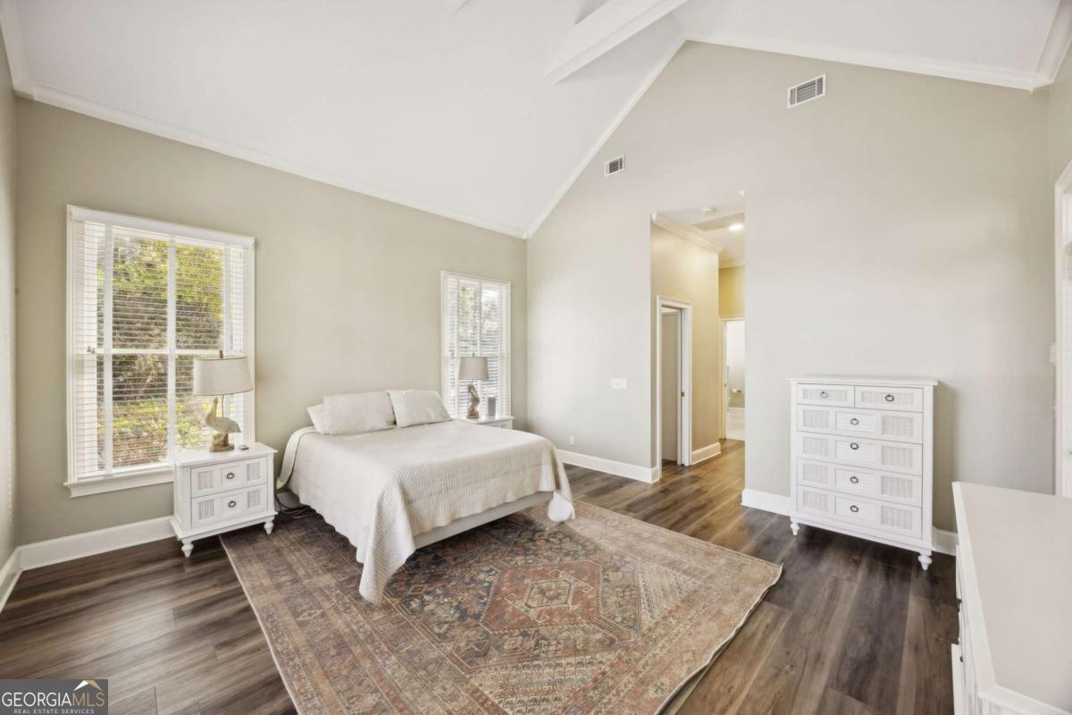 343 Major Wright Road St. Simons, GA 31522 - Photo 20 of 53 a bedroom with a bed and a window