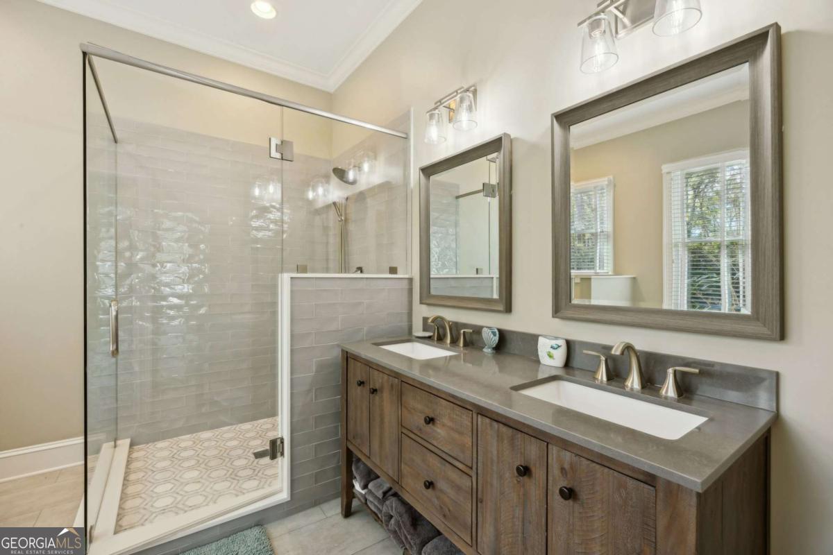 343 Major Wright Road St. Simons, GA 31522 - Photo 22 of 53 a bathroom with a granite countertop sink mirror and double