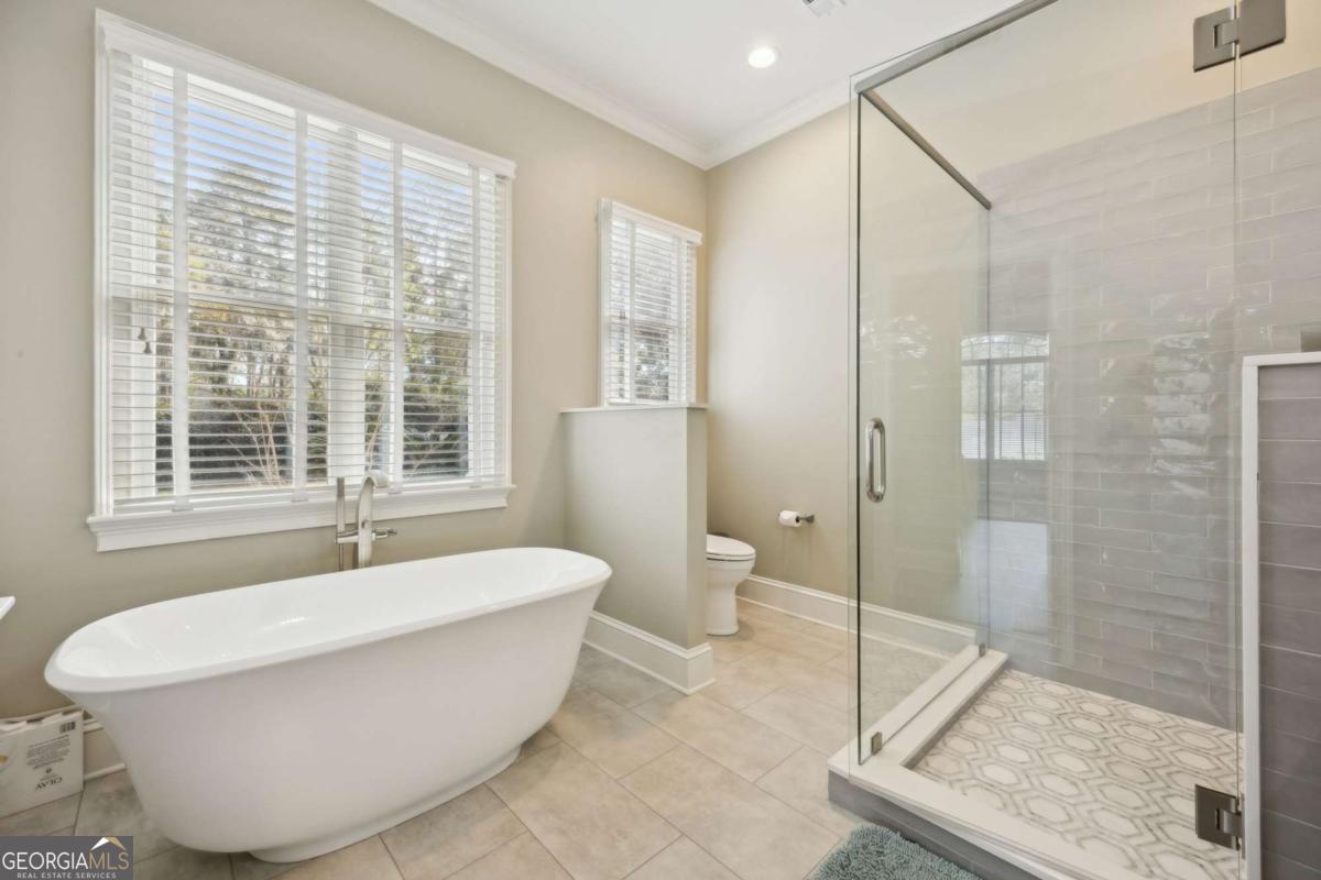 343 Major Wright Road St. Simons, GA 31522 - Photo 24 of 53 a white bath tub sitting next to a toilet