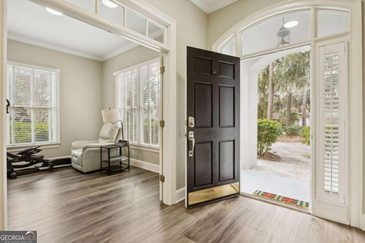 343 Major Wright Road St. Simons, GA 31522 - Photo 3 of 53 a living room with furniture and wooden floor