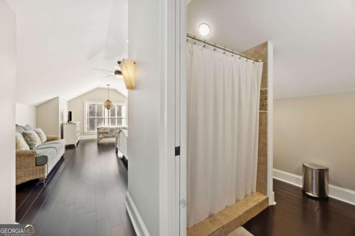 343 Major Wright Road St. Simons, GA 31522 - Photo 31 of 53 a view of a bedroom with bed and workspace