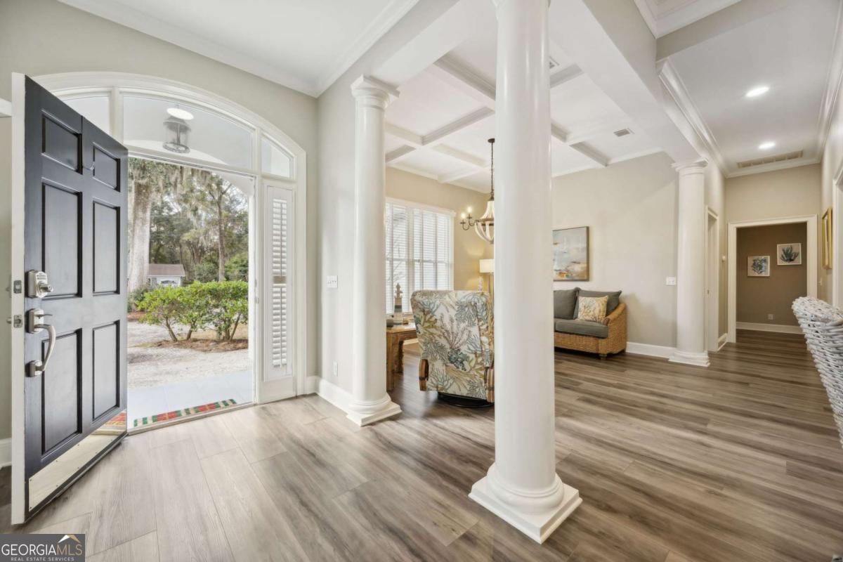 343 Major Wright Road St. Simons, GA 31522 - Photo 4 of 53 a view of a living room and hardwood floor