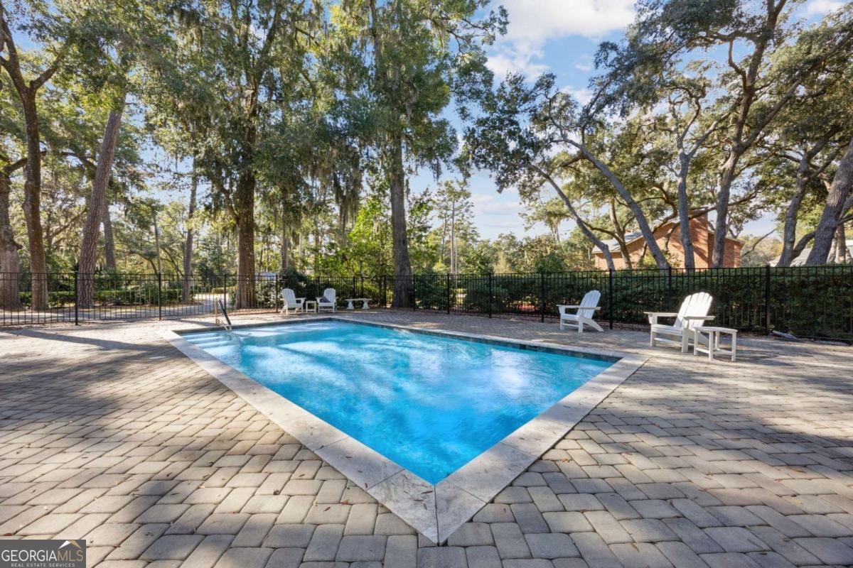 343 Major Wright Road St. Simons, GA 31522 - Photo 43 of 53 a view of swimming pool with seating space