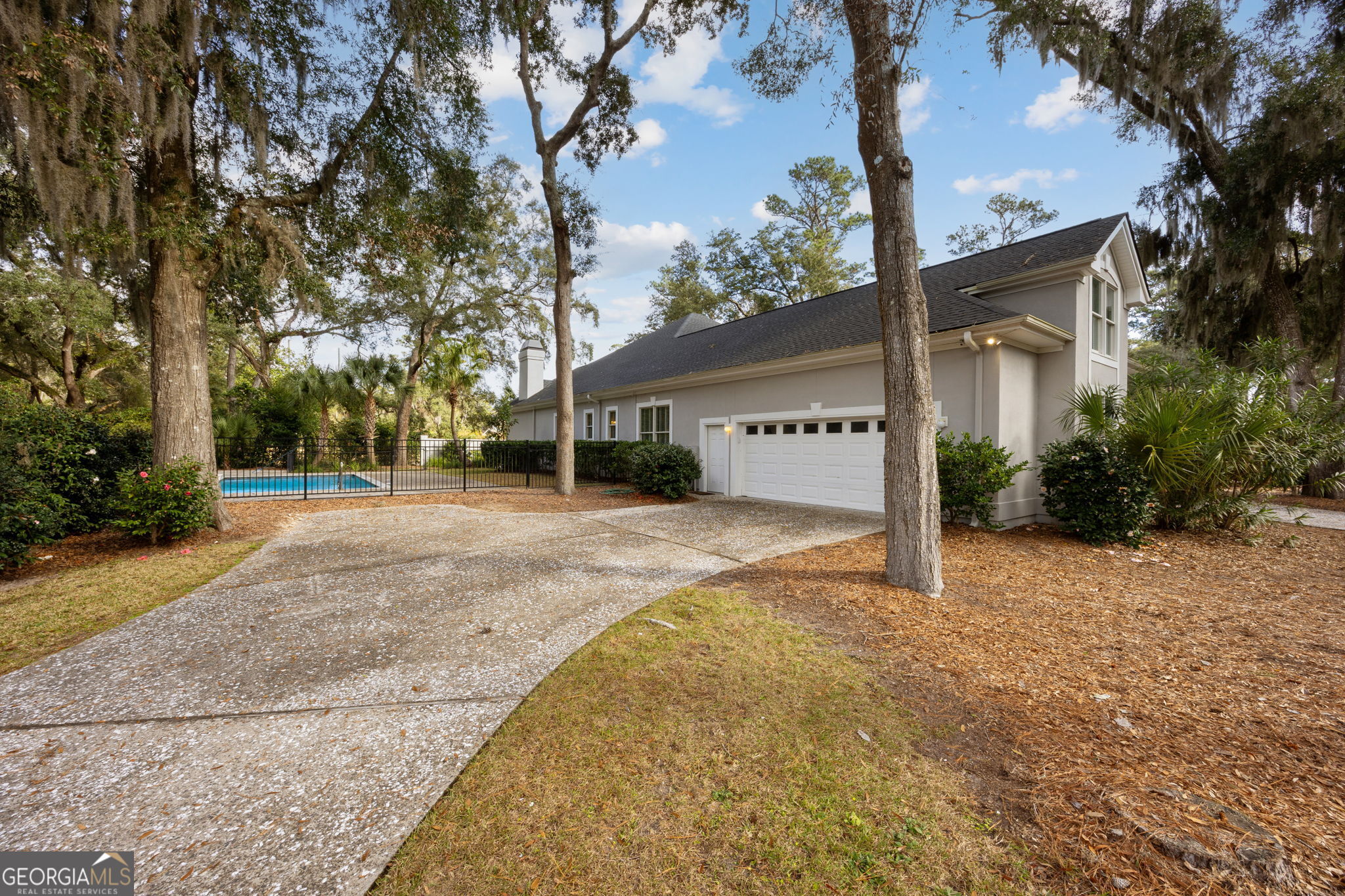 343 Major Wright Road St. Simons, GA 31522 - Photo 46 of 53 front view of a house with a yard and an trees