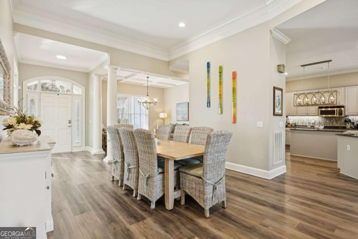 343 Major Wright Road St. Simons, GA 31522 - Photo 9 of 53 a view of a dining room with furniture and wooden floor