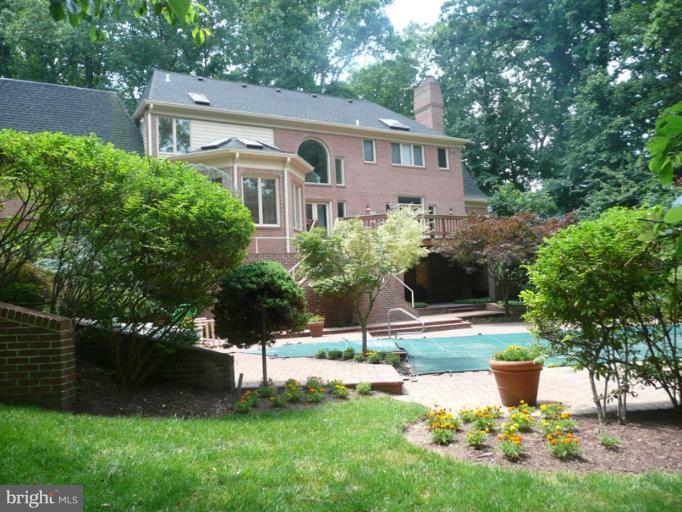 11008 South Glen Road Potomac, MD 20854 - Photo 2 of 12 a front view of a house with a yard