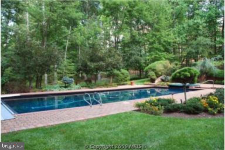 11008 South Glen Road Potomac, MD 20854 - Photo 4 of 12 a view of yard with grass and trees