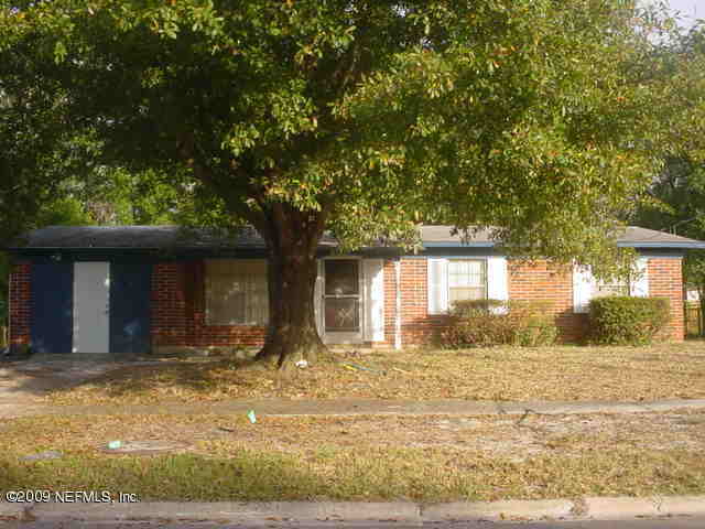 10905 Player Road West Jacksonville, FL 32218 - Photo 1 of 1 a front view of a house with a yard